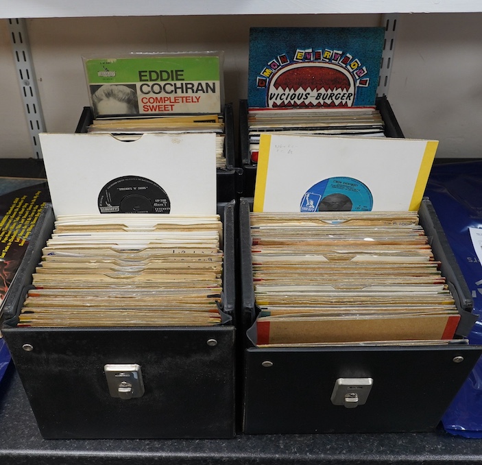 Four 7” singles carry cases containing a large collection of mainly Eddie Cochran 7” singles, a few in picture sleeves, on labels, including; London, Rock Star, etc. Condition - fair